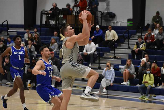 Marian's Hayden Langkabel drives for a layup against Bethel University.